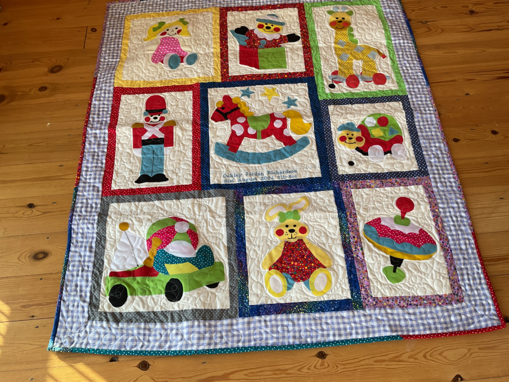 Toy shop appliqué quilt.